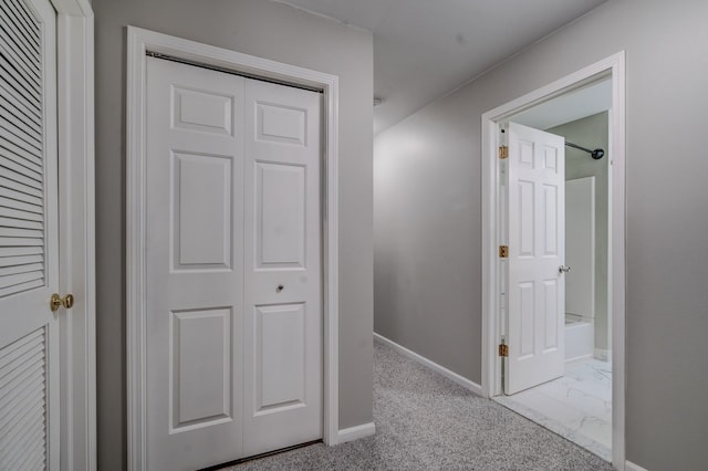 corridor with light colored carpet