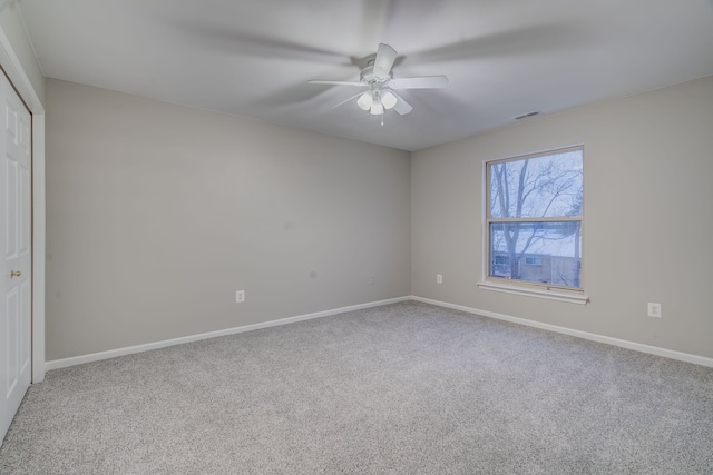 unfurnished room featuring carpet flooring and ceiling fan