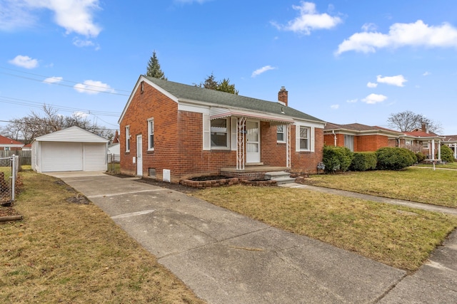 bungalow featuring an outbuilding, a front yard, and a garage