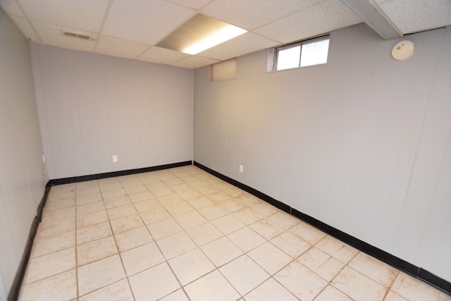 empty room featuring a drop ceiling