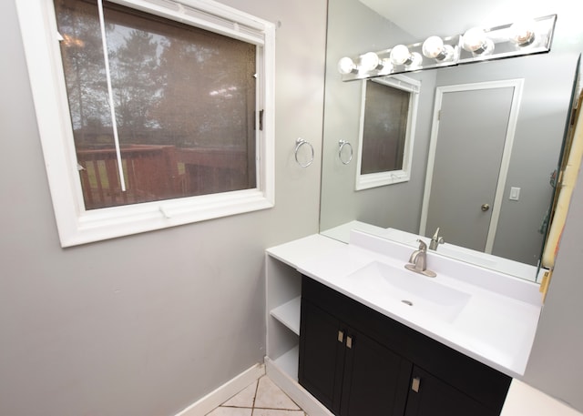 bathroom with tile patterned flooring and vanity