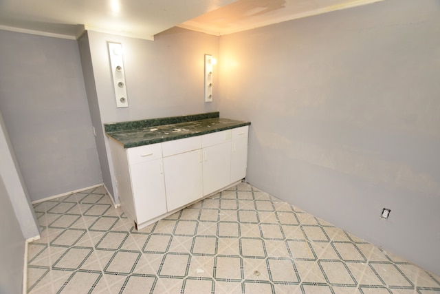 kitchen featuring white cabinets