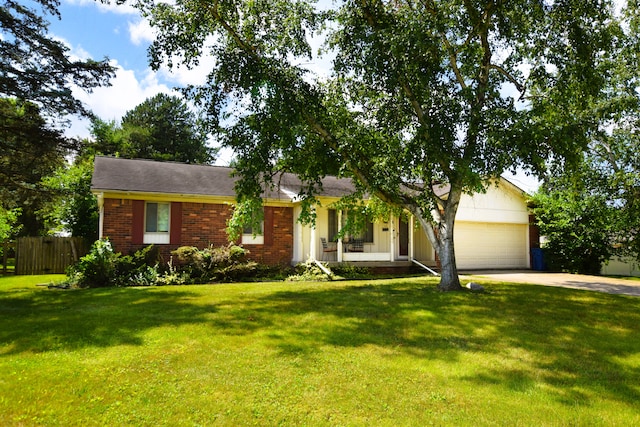 ranch-style home featuring a garage and a front yard