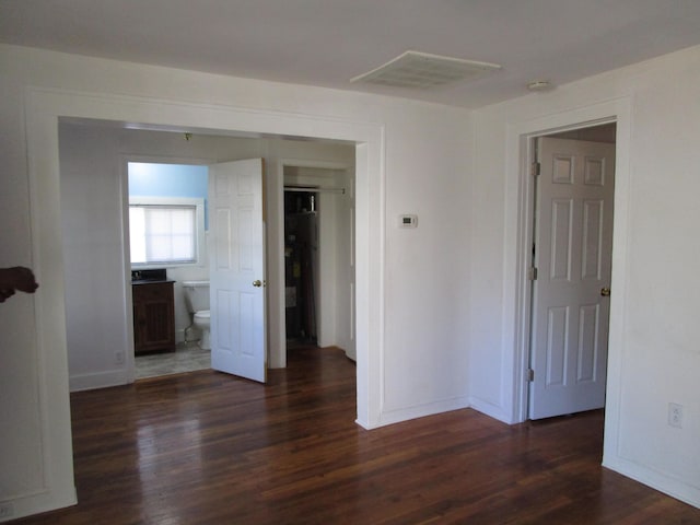 empty room featuring dark hardwood / wood-style flooring