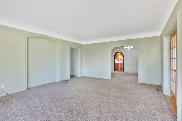 spare room with light colored carpet