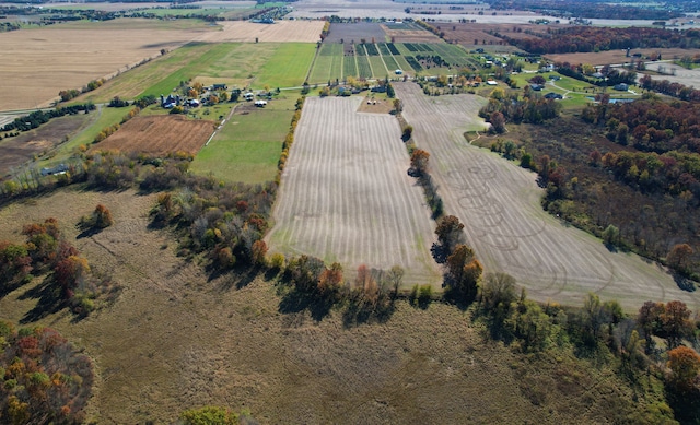 birds eye view of property with a rural view