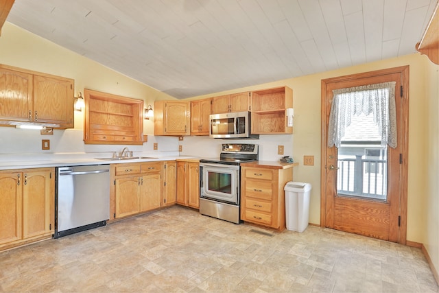 kitchen with sink, wooden ceiling, lofted ceiling, and appliances with stainless steel finishes