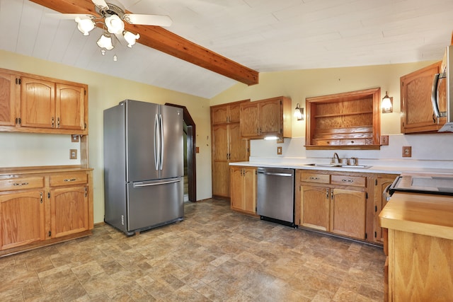 kitchen with ceiling fan, lofted ceiling with beams, sink, and stainless steel appliances