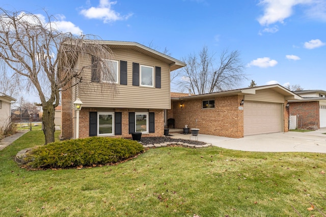 split level home with a garage and a front lawn