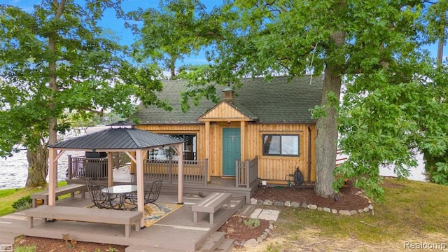 10086 King Rd, Davisburg, MI 48350 - view of front of property with a gazebo, roof with shingles, and a wooden deck