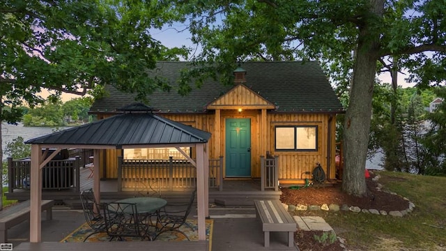 view of front of house with a gazebo and a wooden deck