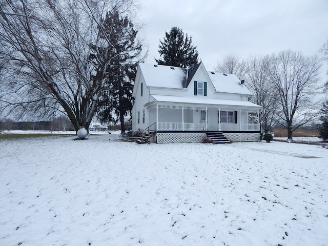 snow covered property featuring a porch