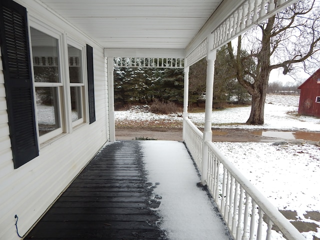 view of snow covered deck