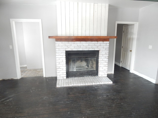 room details with hardwood / wood-style flooring and a brick fireplace