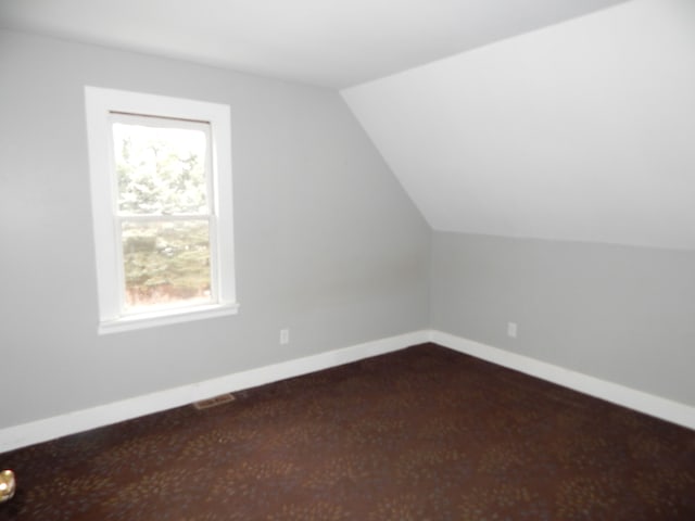 bonus room with vaulted ceiling