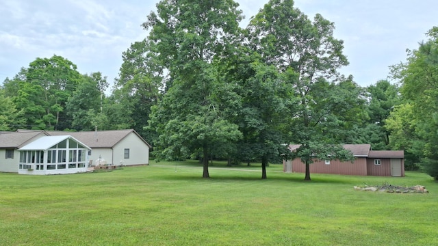 view of yard featuring a sunroom