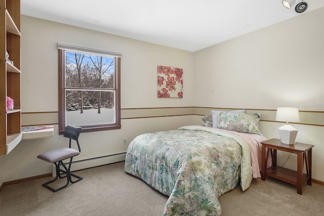 carpeted bedroom with baseboard heating