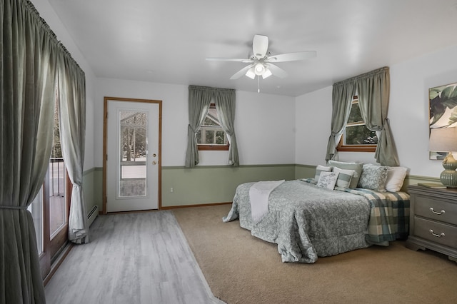 bedroom featuring ceiling fan, access to exterior, and light wood-type flooring