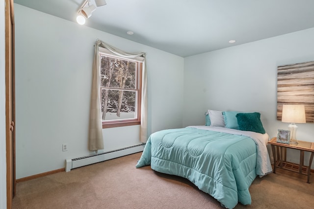 carpeted bedroom with a baseboard heating unit