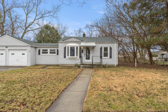 view of front of home with a garage and a front yard