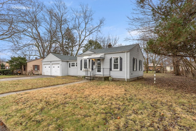 view of front of property with a front lawn and a garage