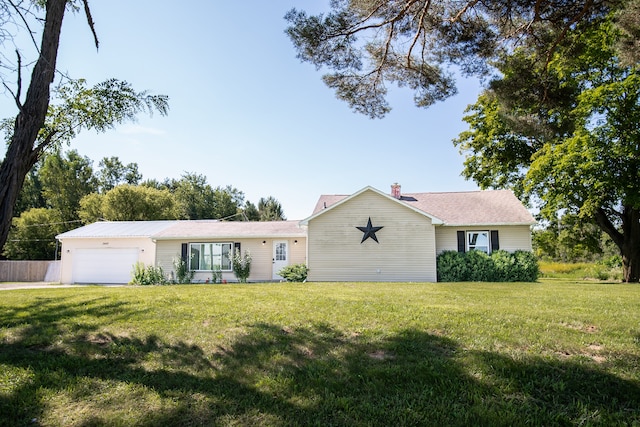 ranch-style home with a front yard and a garage