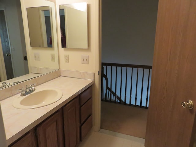 bathroom with vanity and tile patterned flooring