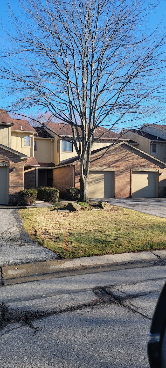 view of front of house with a garage and a front yard