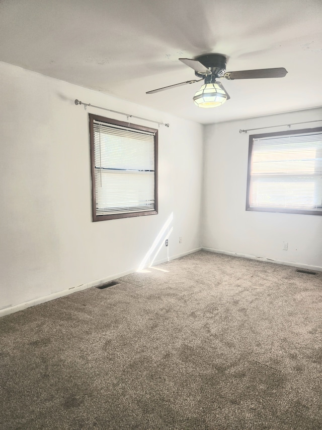 carpeted empty room with ceiling fan