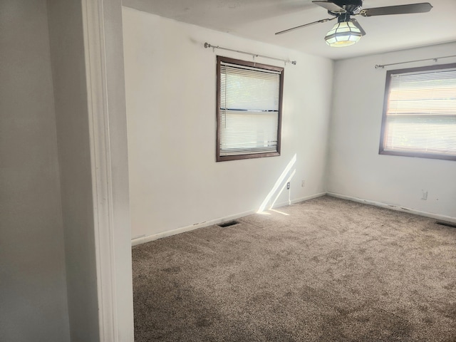 carpeted empty room with ceiling fan