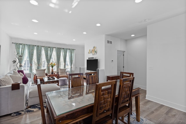 dining space featuring light hardwood / wood-style flooring