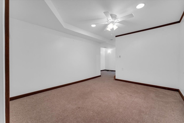 spare room featuring carpet floors and ceiling fan