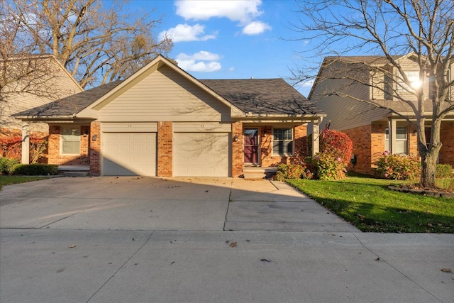 view of front facade with a garage and a front lawn