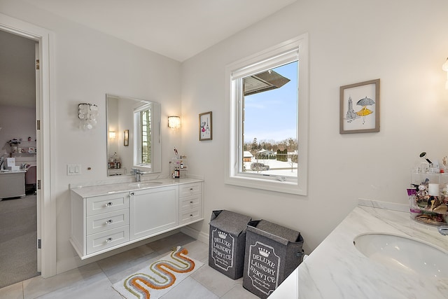 bathroom with two vanities and tile patterned floors