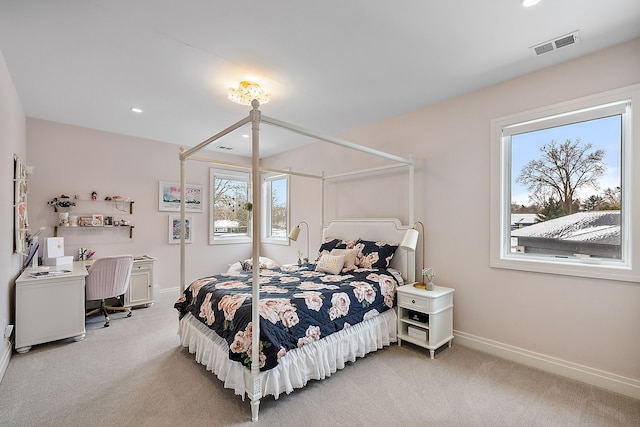 bedroom featuring light carpet, baseboards, and recessed lighting