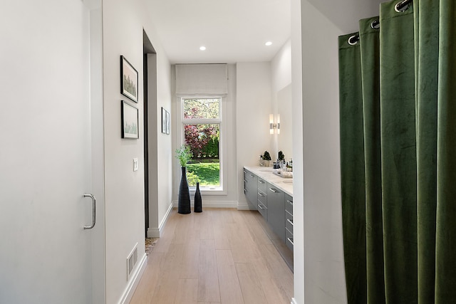 full bath with wood finished floors, baseboards, recessed lighting, and vanity