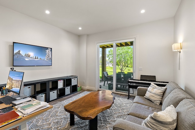 living area with wood finished floors, recessed lighting, and baseboards