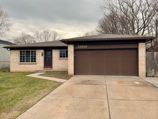 view of front of home with a front lawn and a garage