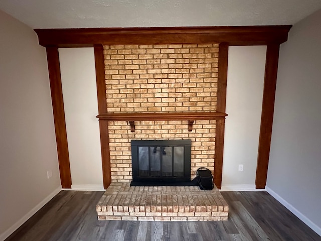 room details with hardwood / wood-style flooring and a brick fireplace