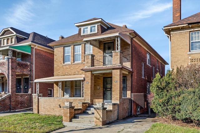 view of front of home with a balcony