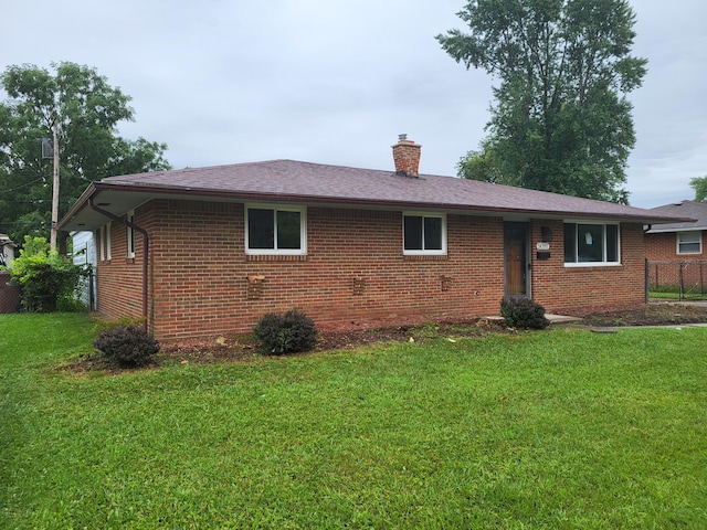 single story home with a front yard