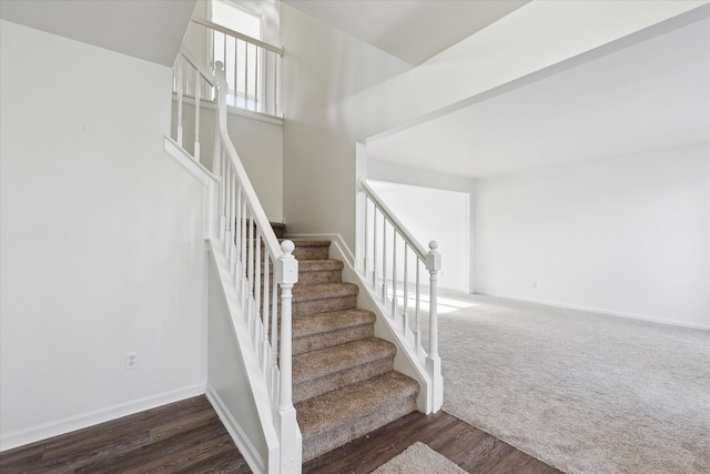 stairs with hardwood / wood-style flooring