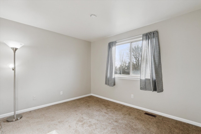 empty room with carpet flooring