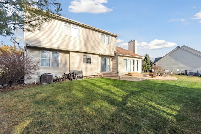 back of house with a lawn, central AC, and a patio