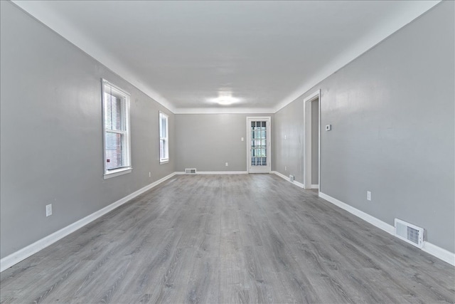 spare room with light wood-type flooring