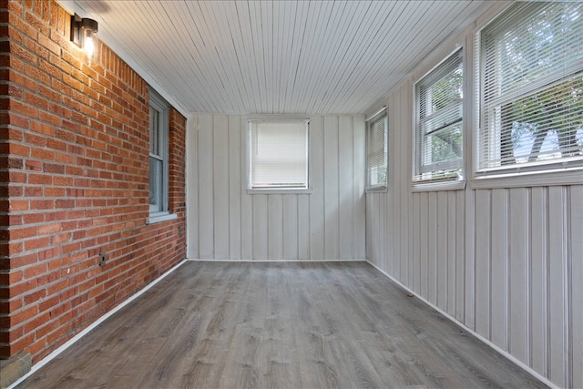 unfurnished sunroom featuring a healthy amount of sunlight