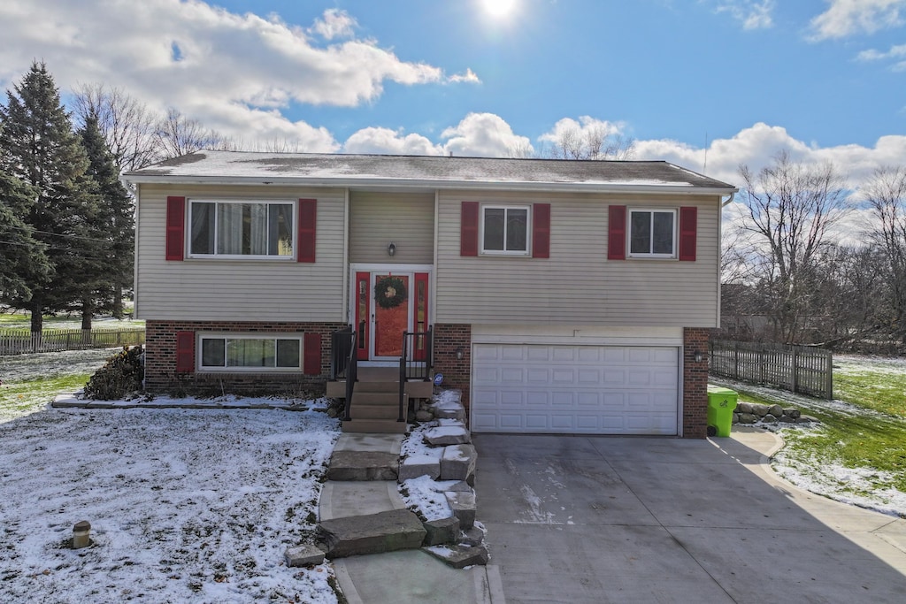 split foyer home featuring a garage