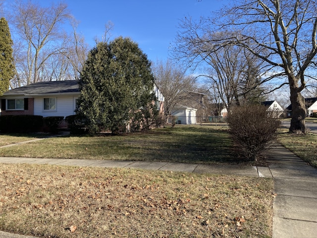 view of property exterior with a lawn