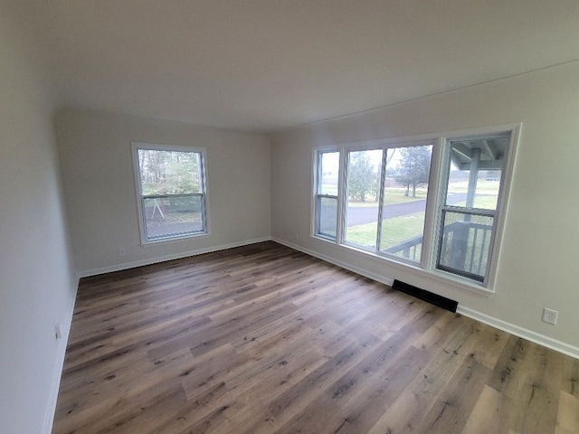 spare room featuring hardwood / wood-style floors