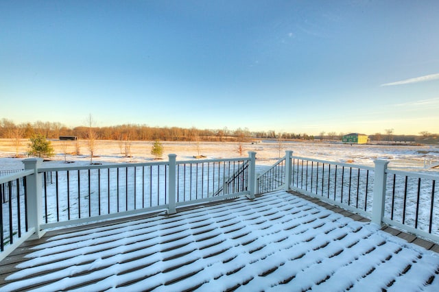 wooden terrace featuring a rural view